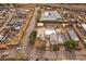 Overhead shot of neighborhood and home, which is surrounded by auto salvage yard, commercial buildings and train tracks at 5182 Thompson Ct, Denver, CO 80216