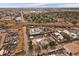 Overhead view of homes and businesses that are near auto salvage yards and commercial buildings plus train tracks at 5182 Thompson Ct, Denver, CO 80216