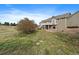 Spacious backyard with a deck and patio area, ideal for outdoor entertaining and relaxation at 3342 Quail Ridge Cir, Parker, CO 80138