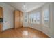 Charming dining area featuring bright light, hardwood floors, and ample cabinet storage at 3342 Quail Ridge Cir, Parker, CO 80138
