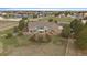 Aerial shot of a well-maintained home and landscaping, complete with a charming backyard and fencing at 3342 Quail Ridge Cir, Parker, CO 80138