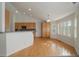 Eat-in kitchen with hardwood floors and breakfast bar area at 3342 Quail Ridge Cir, Parker, CO 80138