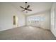 Spacious main bedroom with vaulted ceilings, large windows, and en-suite bathroom access at 3342 Quail Ridge Cir, Parker, CO 80138