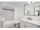 Clean bathroom featuring a shower/tub combo, white vanity, and a large mirror at 1495 Zamia Ave # 3, Boulder, CO 80304