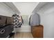 Functional walk-in closet with ample hanging space and a wooden dresser at 1495 Zamia Ave # 3, Boulder, CO 80304