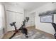 Home gym with an exercise bike, closet doors, and natural light at 1495 Zamia Ave # 3, Boulder, CO 80304
