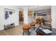 Open-concept living area with hardwood flooring, modern decor, and a view of the adjacent kitchen and dining space at 1495 Zamia Ave # 3, Boulder, CO 80304