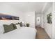 Spacious main bedroom featuring a plush queen-size bed and views of the ensuite bathroom at 1495 Zamia Ave # 3, Boulder, CO 80304