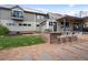 Rear view of the home with a patio, bar, and backyard space showcases outdoor living at 700 Cheyenne St, Golden, CO 80401