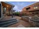 The outdoor space features a built-in grill, bar seating, and a covered patio adjacent to the main house at 700 Cheyenne St, Golden, CO 80401