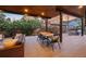 The covered patio offers comfortable seating, an outdoor dining area, and a built-in grill at 700 Cheyenne St, Golden, CO 80401