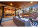 The covered patio boasts a brick fireplace, comfortable seating, and a seamless indoor-outdoor flow at 700 Cheyenne St, Golden, CO 80401