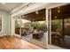 Covered patio view from inside features a fireplace, seating area, and dining table at 700 Cheyenne St, Golden, CO 80401