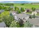 Aerial view of a beautiful home with a large yard and patio in a desirable neighborhood at 14878 E Aberdeen Ave, Centennial, CO 80016