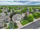 Aerial view of a home in a residential neighborhood with mature landscaping at 14878 E Aberdeen Ave, Centennial, CO 80016