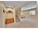 Finished basement features a carpeted floor, recreational area, and recessed lighting at 14878 E Aberdeen Ave, Centennial, CO 80016