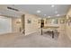 Finished basement rec room with carpeted floors, recessed lighting and ping pong table at 14878 E Aberdeen Ave, Centennial, CO 80016
