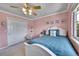 Comfortable bedroom with pink walls, a ceiling fan, and a white bed frame at 14878 E Aberdeen Ave, Centennial, CO 80016