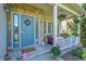 Charming front porch featuring a welcoming entrance and beautiful stone accents, inviting you to relax and enjoy the outdoors at 14878 E Aberdeen Ave, Centennial, CO 80016