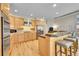 Eat-in kitchen with a spacious island, stainless steel appliances, and ample cabinet space, ideal for cooking and entertaining at 14878 E Aberdeen Ave, Centennial, CO 80016