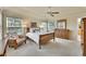 Spacious main bedroom boasts abundant natural light, ceiling fan, and neutral decor at 14878 E Aberdeen Ave, Centennial, CO 80016