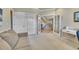 Office room with a couch and access to the staircase at 14878 E Aberdeen Ave, Centennial, CO 80016