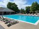 Community pool featuring lounge chairs and a nearby pavilion for residents' enjoyment at 14878 E Aberdeen Ave, Centennial, CO 80016