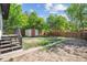 Landscaped backyard featuring a shed, lawn, and a wood fence at 4624 S Lincoln St, Englewood, CO 80113