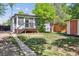 Backyard with a shed, lawn, deck and a wood fence at 4624 S Lincoln St, Englewood, CO 80113