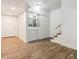Basement laundry area with laminate flooring and access to stairs at 4624 S Lincoln St, Englewood, CO 80113