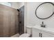 Updated bathroom featuring a modern tile shower and vanity at 4624 S Lincoln St, Englewood, CO 80113