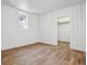 Bedroom with laminate flooring, closet and a bright window at 4624 S Lincoln St, Englewood, CO 80113
