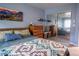 Bedroom featuring natural light, ample storage and stylish mountain decor accents at 2557 S Dover St # 85, Lakewood, CO 80227