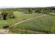 View of a lush green space with walking paths and tranquil ponds, perfect for outdoor enjoyment at 2557 S Dover St # 85, Lakewood, CO 80227