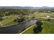 Scenic view of green space with a peaceful lake, walking trails and mature trees at 2557 S Dover St # 85, Lakewood, CO 80227