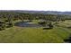Expansive green space featuring a serene lake and winding paths, ideal for recreation and relaxation at 2557 S Dover St # 85, Lakewood, CO 80227