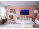 Inviting living room with comfortable seating, decorative shelves, and stylish decor at 2557 S Dover St # 85, Lakewood, CO 80227