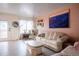 Comfortable living room with a cozy sofa, accent chair, and ample natural light at 2557 S Dover St # 85, Lakewood, CO 80227