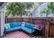 Cozy patio offers comfortable blue sectional seating and a unique red-and-white checkered floor at 2557 S Dover St # 85, Lakewood, CO 80227