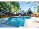 Community pool offers a refreshing escape with lounge chairs and mature trees around the perimeter at 2557 S Dover St # 85, Lakewood, CO 80227