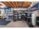 Spacious basement has built in shelves, exposed ceiling, concrete wall, and carpet at 15353 E 98Th Pl, Commerce City, CO 80022