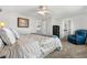 Bedroom with a neutral color scheme and an accent chair at 15353 E 98Th Pl, Commerce City, CO 80022