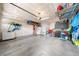 Spacious garage with high ceilings, overhead storage, and ample room for parking and storage at 15353 E 98Th Pl, Commerce City, CO 80022