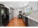 Bright kitchen with white subway tile backsplash and gray lower cabinets with stainless steel appliances at 15353 E 98Th Pl, Commerce City, CO 80022