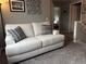 Cozy living room with neutral walls, a comfortable couch, and lots of natural light at 15353 E 98Th Pl, Commerce City, CO 80022