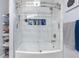 Clean white tiled shower with clear glass door at 15353 E 98Th Pl, Commerce City, CO 80022