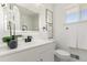 A stylish bathroom featuring black fixtures, white countertop and modern decor at 6699 S Pennsylvania St, Centennial, CO 80121