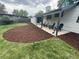 Landscaped backyard with a concrete patio featuring seating at 1420 S Leyden St, Denver, CO 80224