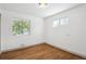 Bright bedroom with hardwood floors and natural light from two windows at 1420 S Leyden St, Denver, CO 80224