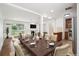 Spacious dining room with an open floor plan, view of the fireplace, and kitchen access at 1420 S Leyden St, Denver, CO 80224